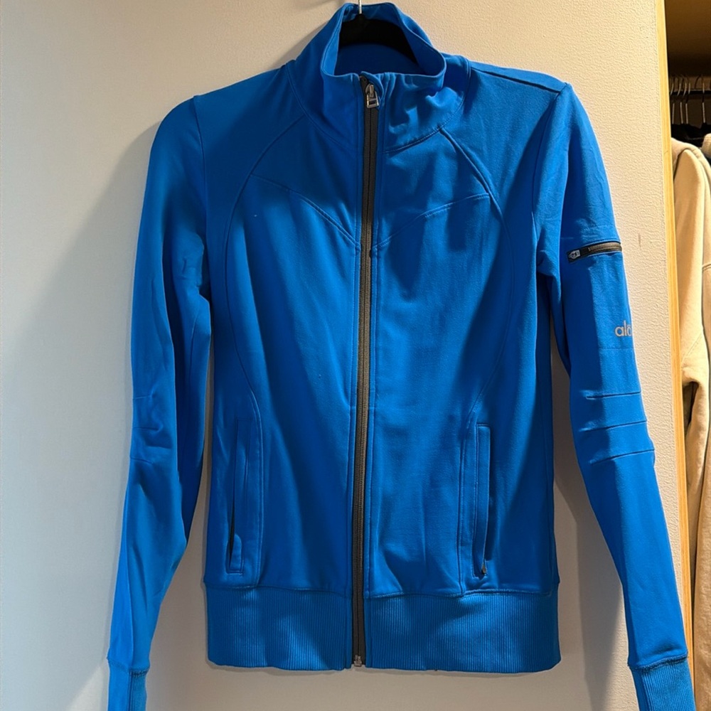 Bright blue Alo workout zip up.